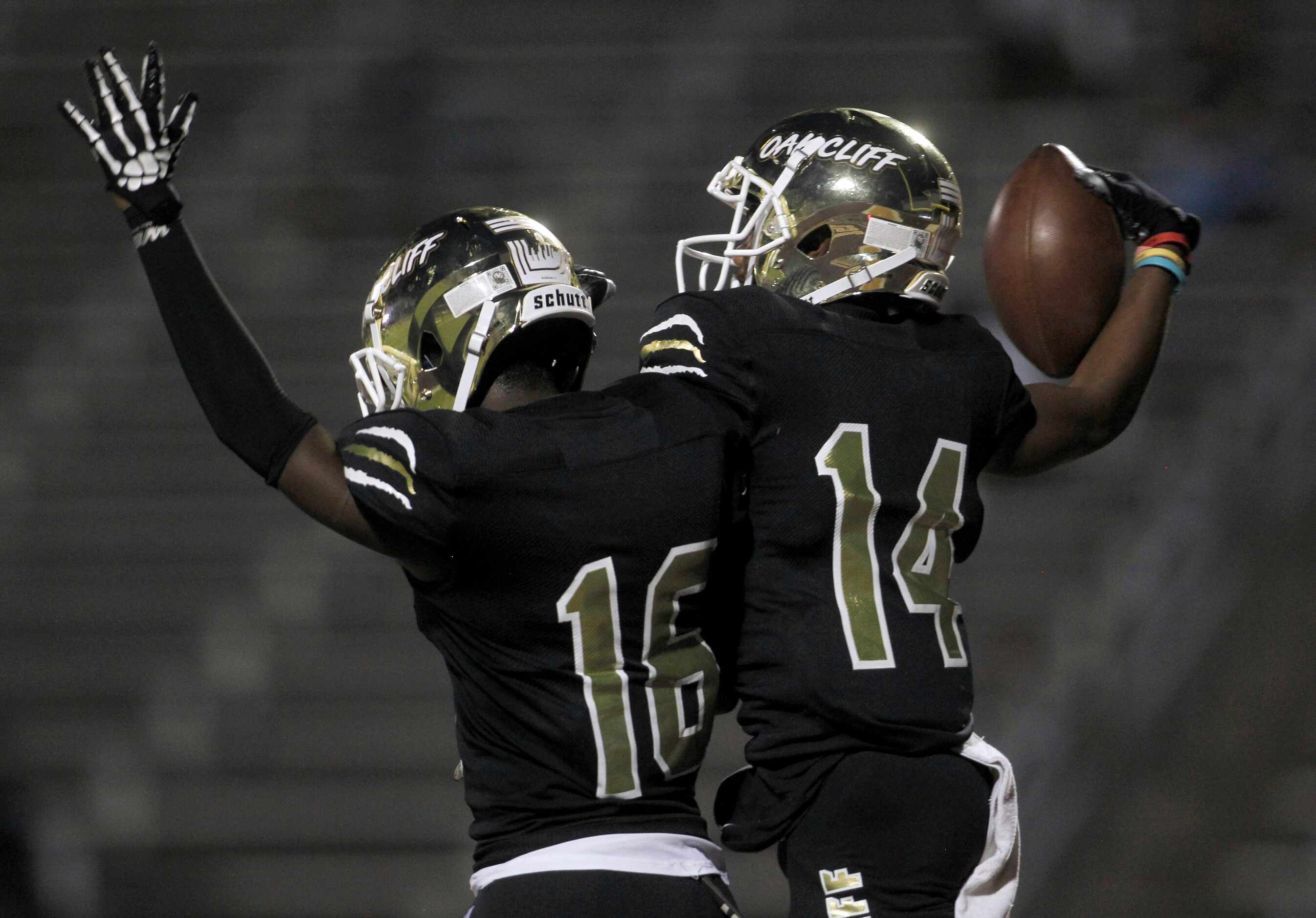 South Oak Cliff receiver Corinthean Coleman (14), right, celebrates with teammate Horace...