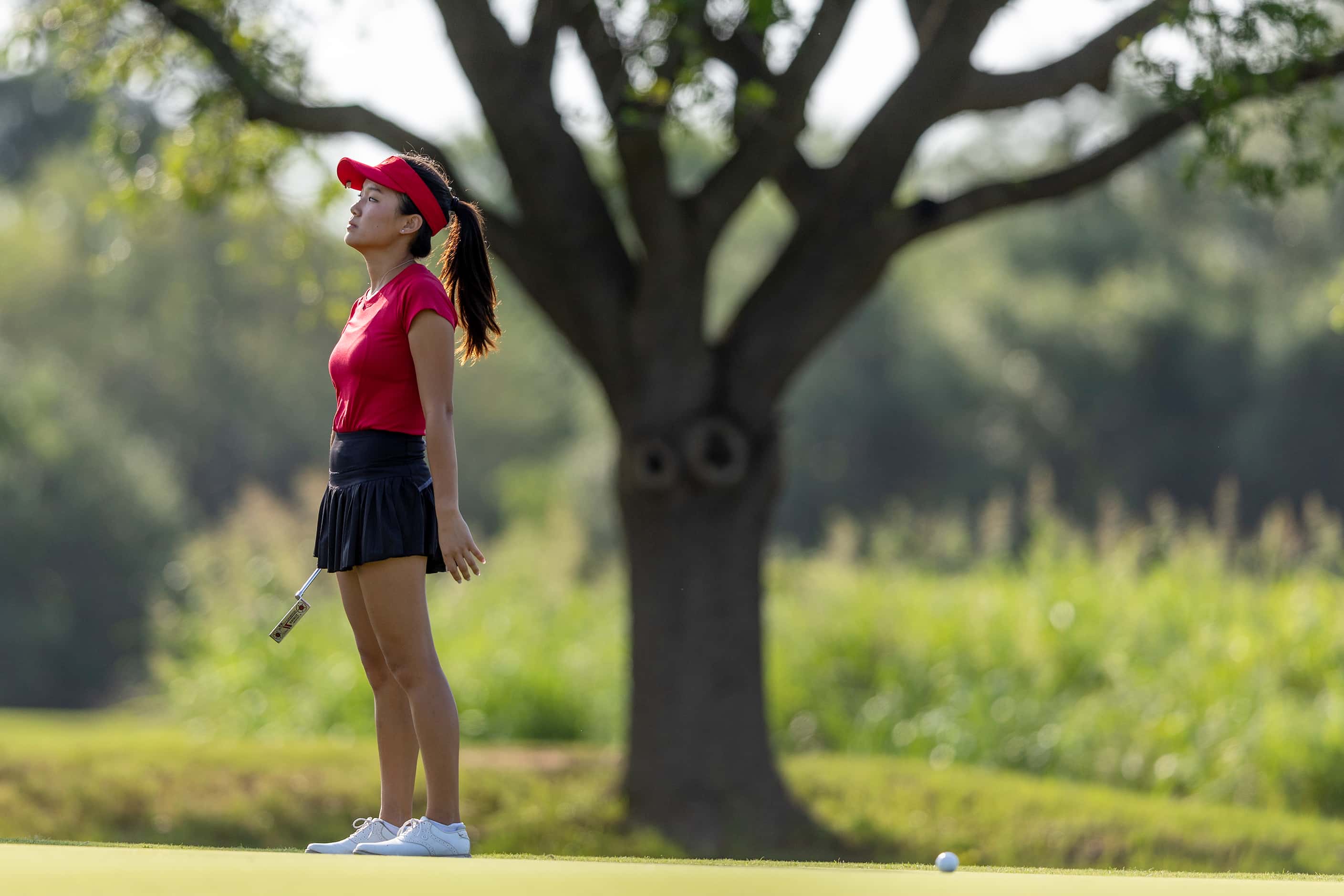 Colleyville Heritage Cindey Xiao reacts to a putt on the 3rd green during the 5A girls state...