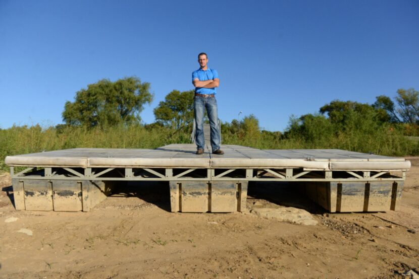 Lake Manager Rob Jordan stands atop the courtesy dock near Oakland Park that has been closed...