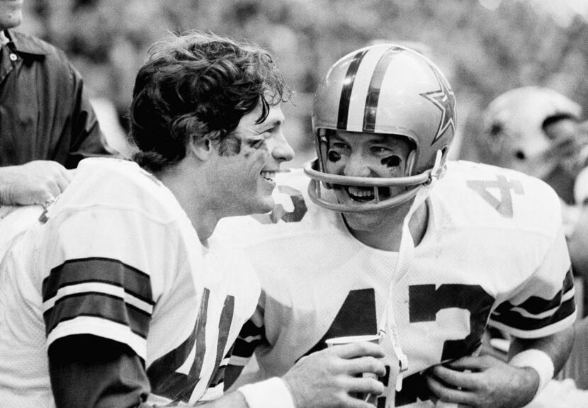 Cliff Harris (right) with fellow Cowboys safety Charlie Waters in the waning moments of a...