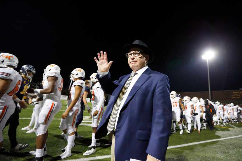 Highland Park head football coach Randy Allen waves to fans after the Scots defeated...