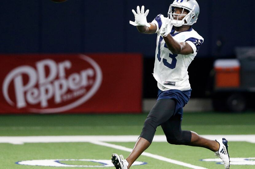 Dallas Cowboys wide receiver Michael Gallup (13) prepares to catch a pass during practice at...