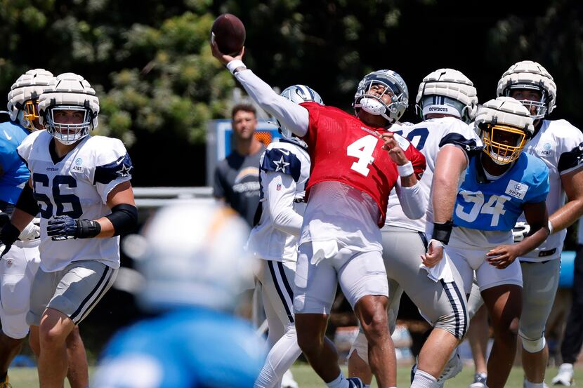 Dallas Cowboys quarterback Dak Prescott (4) heaves a Hail Mary pass to wide receiver Dennis...