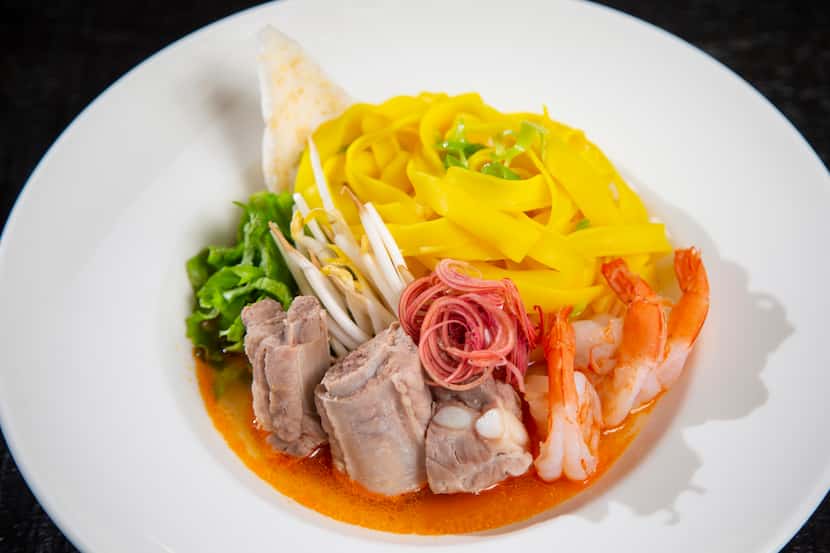 Mì Quảng is made with shrimp, pork ribs, turmeric rice noodles and served in a tomato broth...