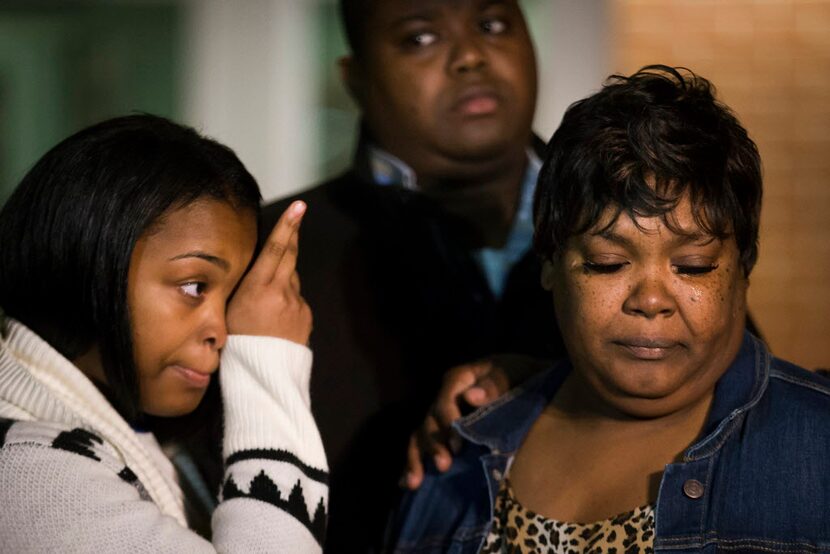 Jacqueline Craig (right) with her 15-year old daughter and cousin Rod Smith outside the Fort...