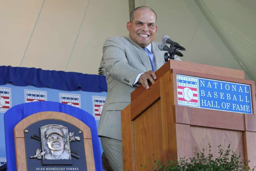 Former Texas Rangers catcher Ivan "Pudge" Rodriguez smiles as he gives his speech during the...