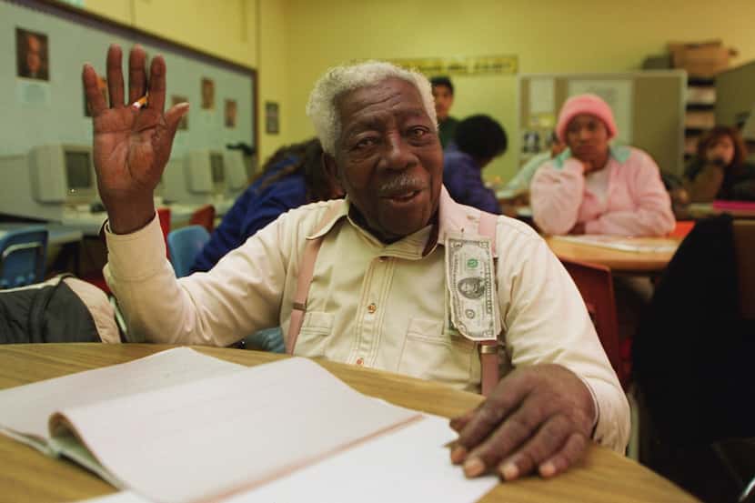 Then-98 year old George Dawson gestures  after receiving much attention during class before...