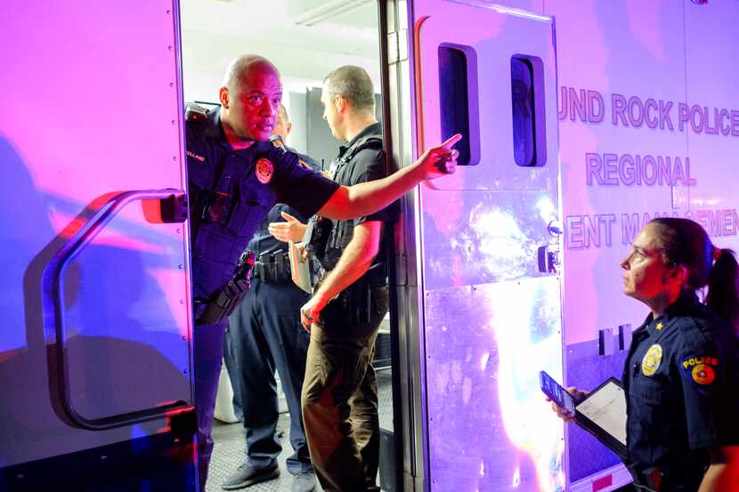 Round Rock police officers coordinate after a fatal shooting during a Juneteenth celebration...