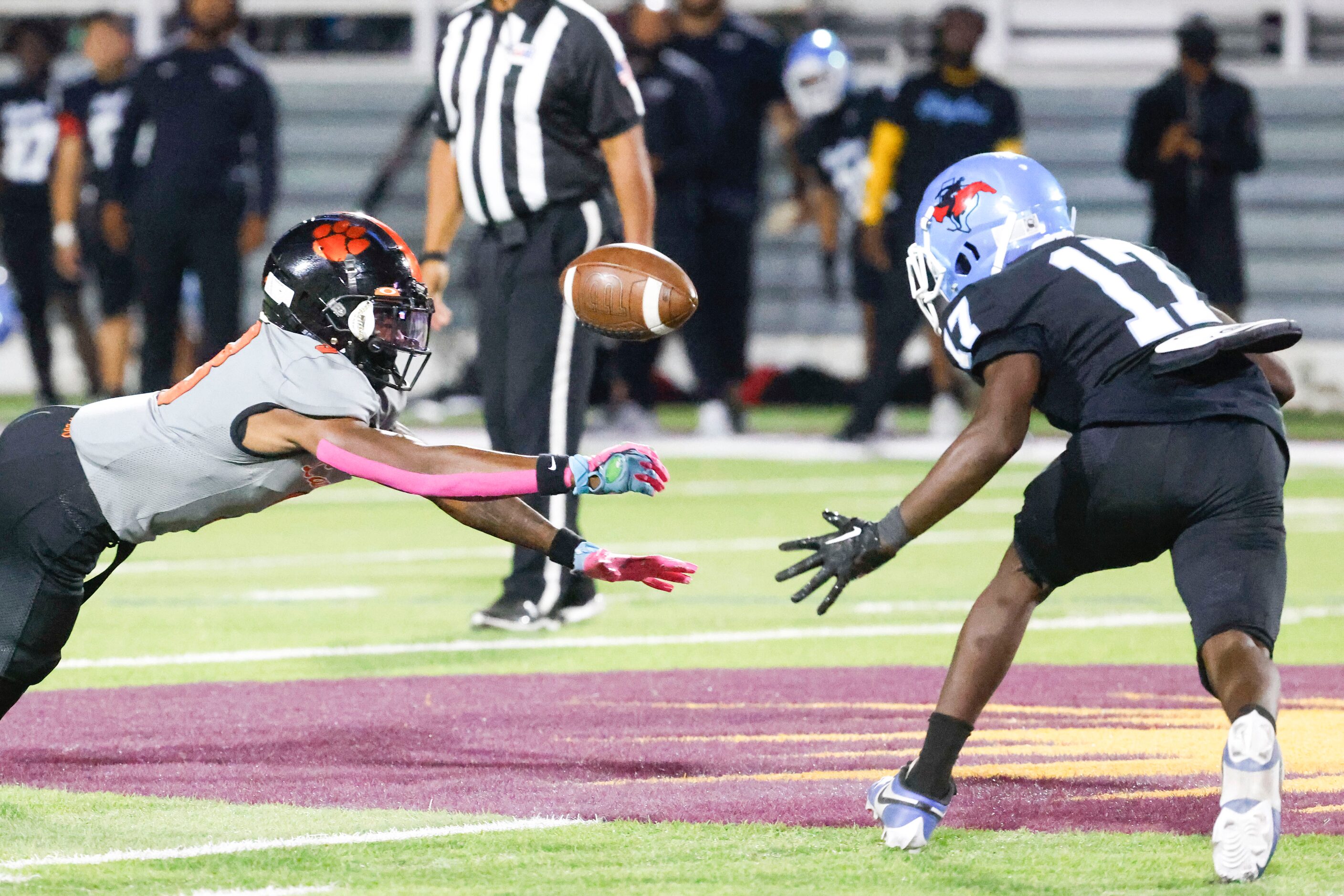 Lancaster High’s Jaquavius Pipkin (left) misses to receive a pass as Skyline High’s Aniaus...