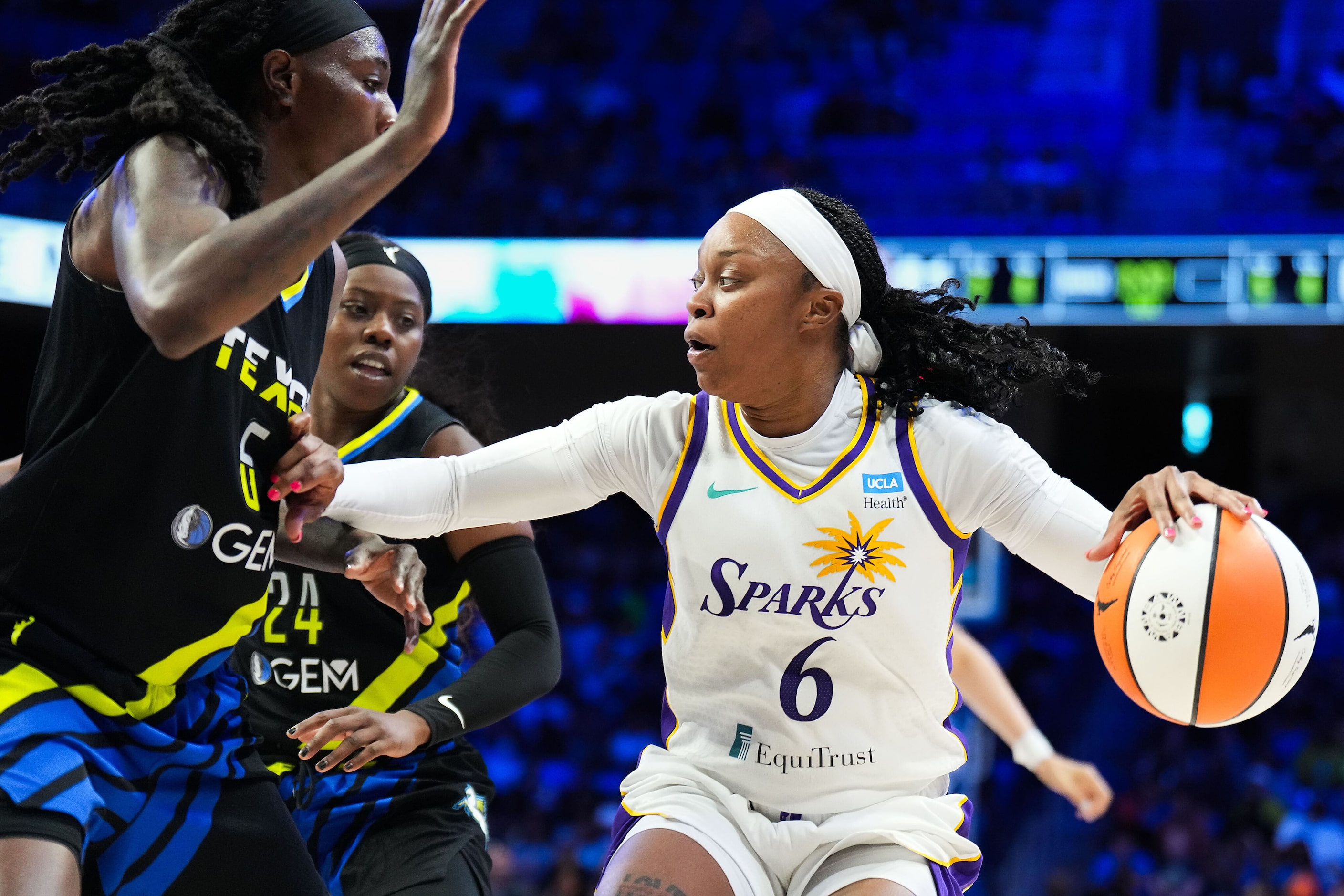 Los Angeles Sparks guard Odyssey Sims (6) is defended by Dallas Wings forward Natasha Howard...