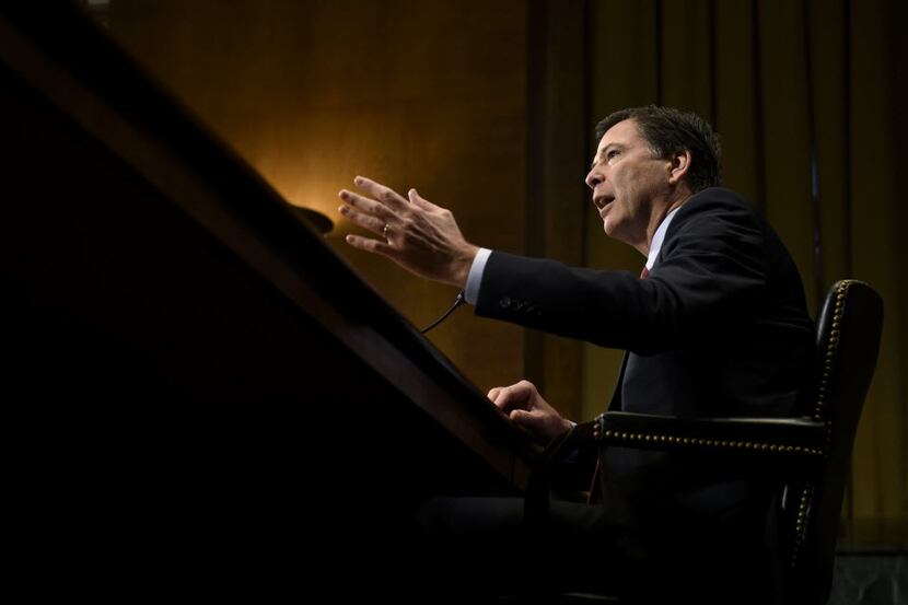  FBI Director James Comey testifies on Capitol Hill on Dec. 9, before the Senate Judiciary...