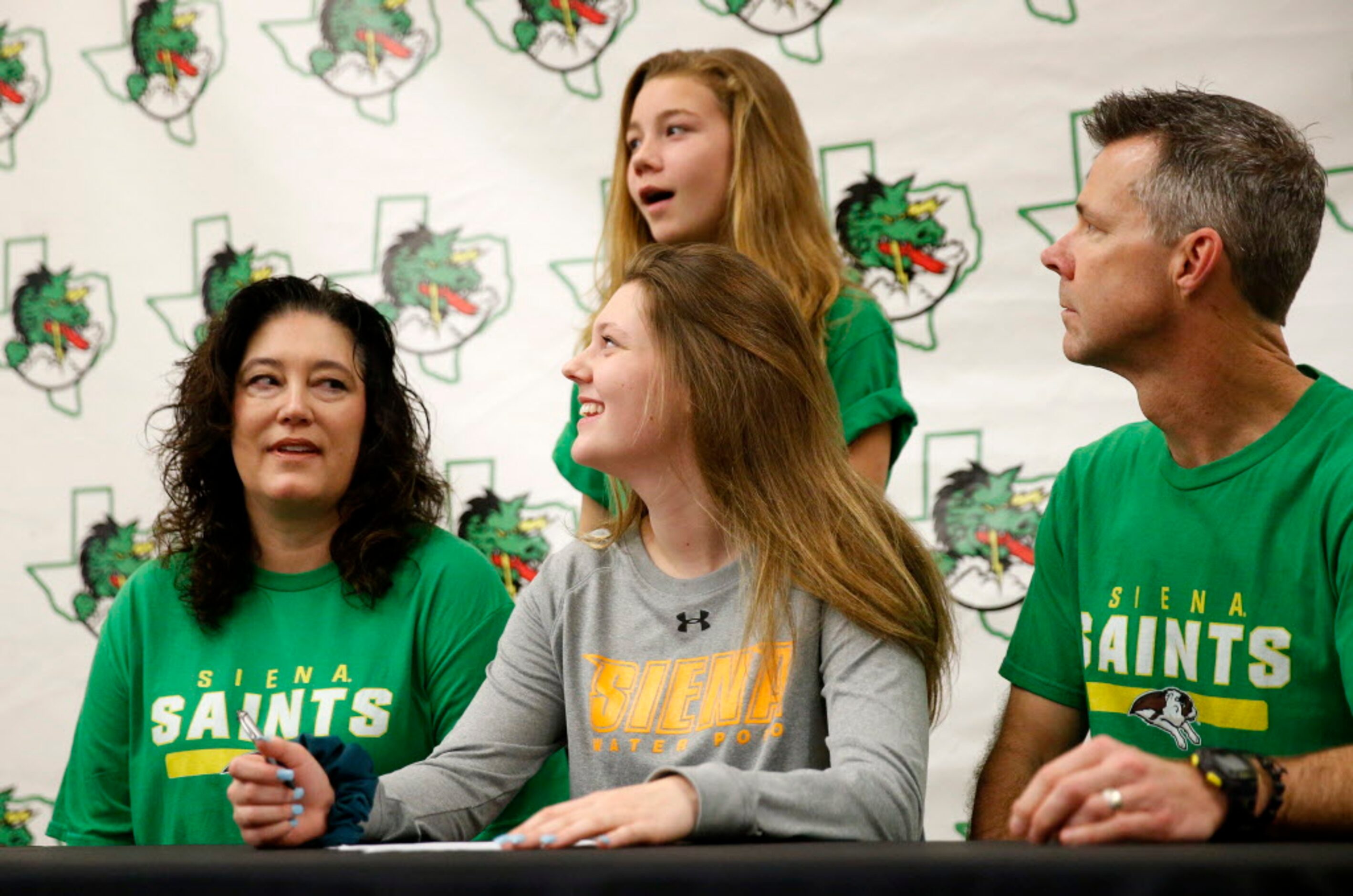 Southlake Carrol water polo player Sydney Jones (center) was joined by her mother Lisa...