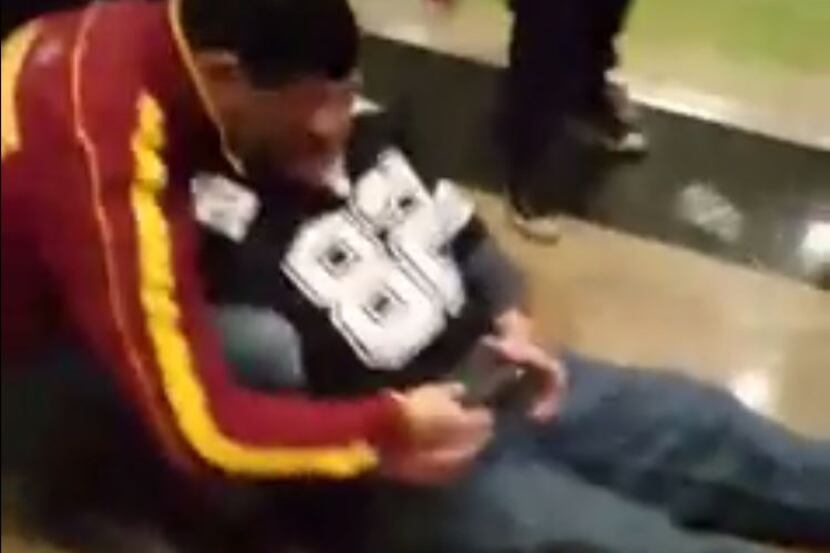 The video shows a Redskins fan apparently trying to help a Cowboys fan injured during the...