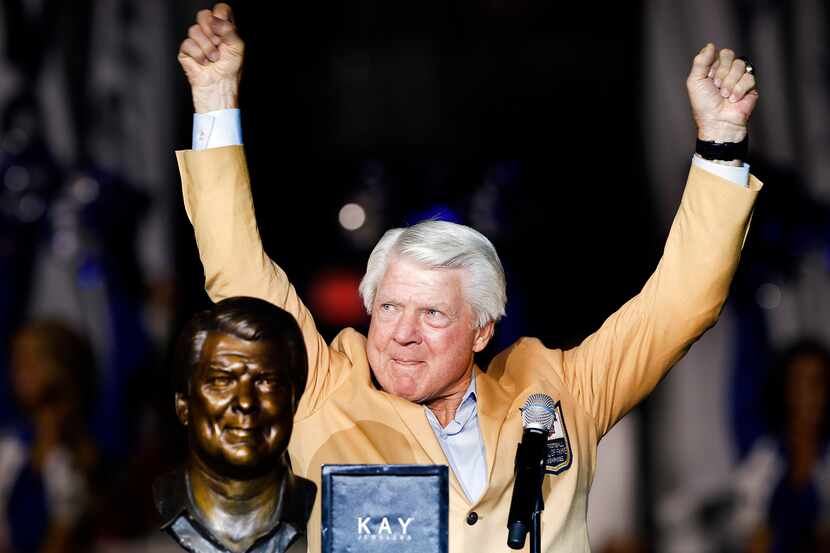 Former Dallas Cowboys head coach and Pro Football Hall of Famer Jimmy Johnson raises his...