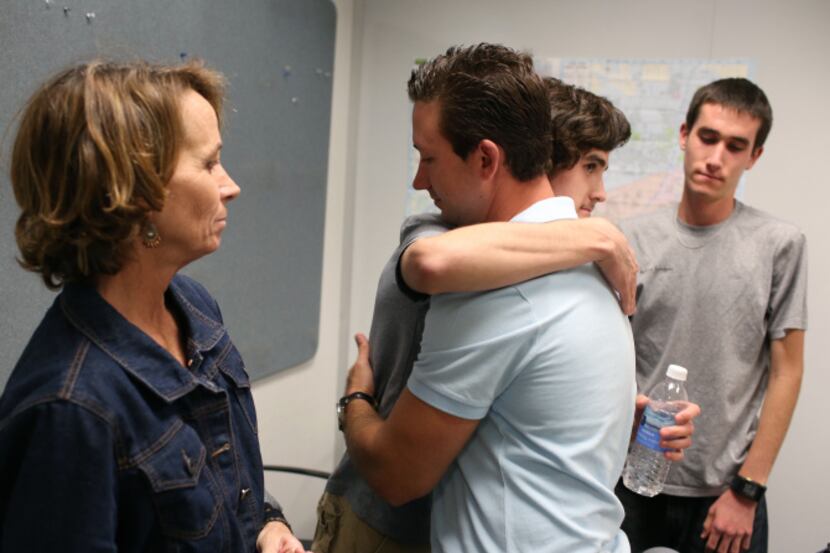 Catherine Swiatocha and her son Jonathan (right) watched Matthew Ayers hug Davy Swiatocha...