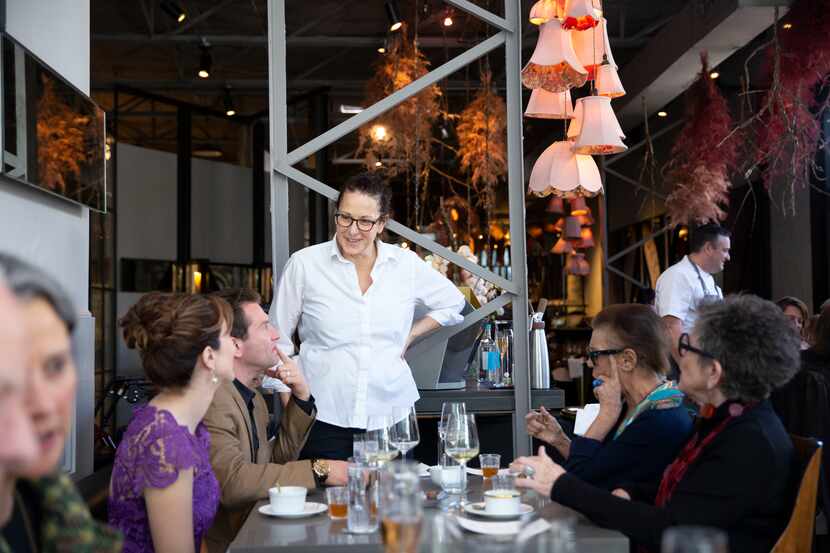 Chef Sharon Hage  visits with guests of The Dallas Morning News EatDrinkInsider Tea Brunch...