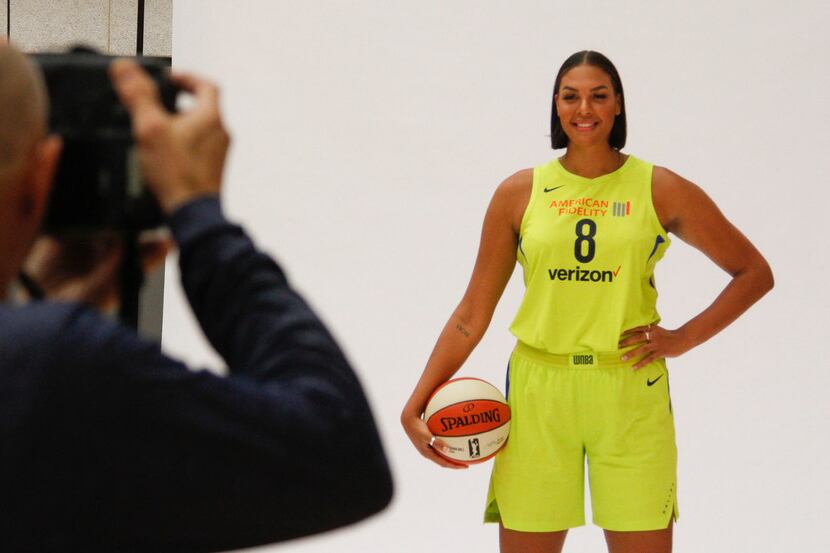 Layne Murdoch photographs Dallas Wings center Liz Cambage (8) during the team's Media Day at...