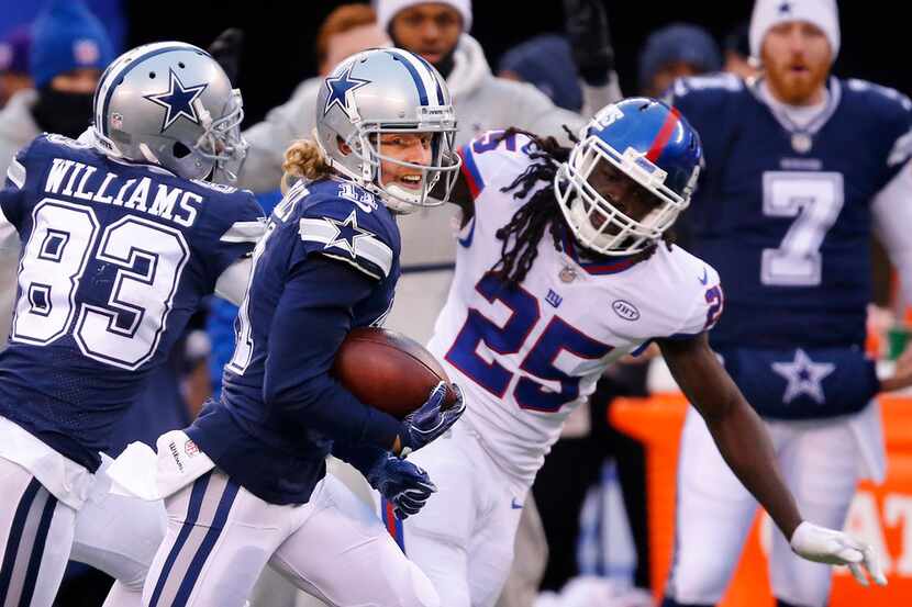 Dallas Cowboys wide receiver Cole Beasley (11) receives a block from fellow receiver...