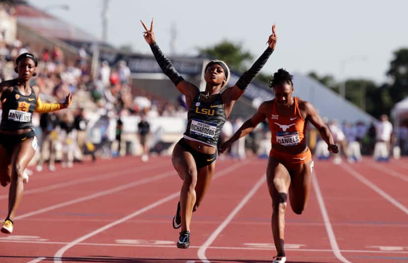 LSU's Sha'Carri Richardson, center, celebrates as she wins the women's 100 meters during the...