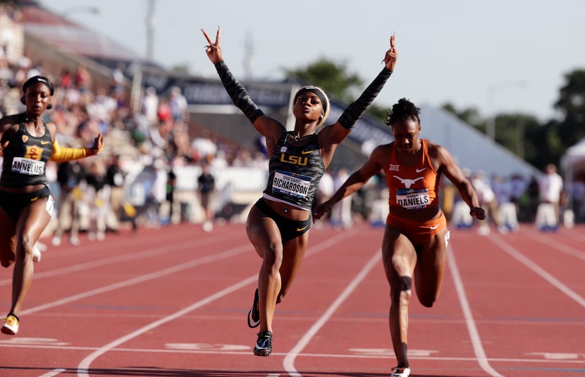 LSU's Sha'Carri Richardson, center, celebrates as she wins the women's 100 meters during the...