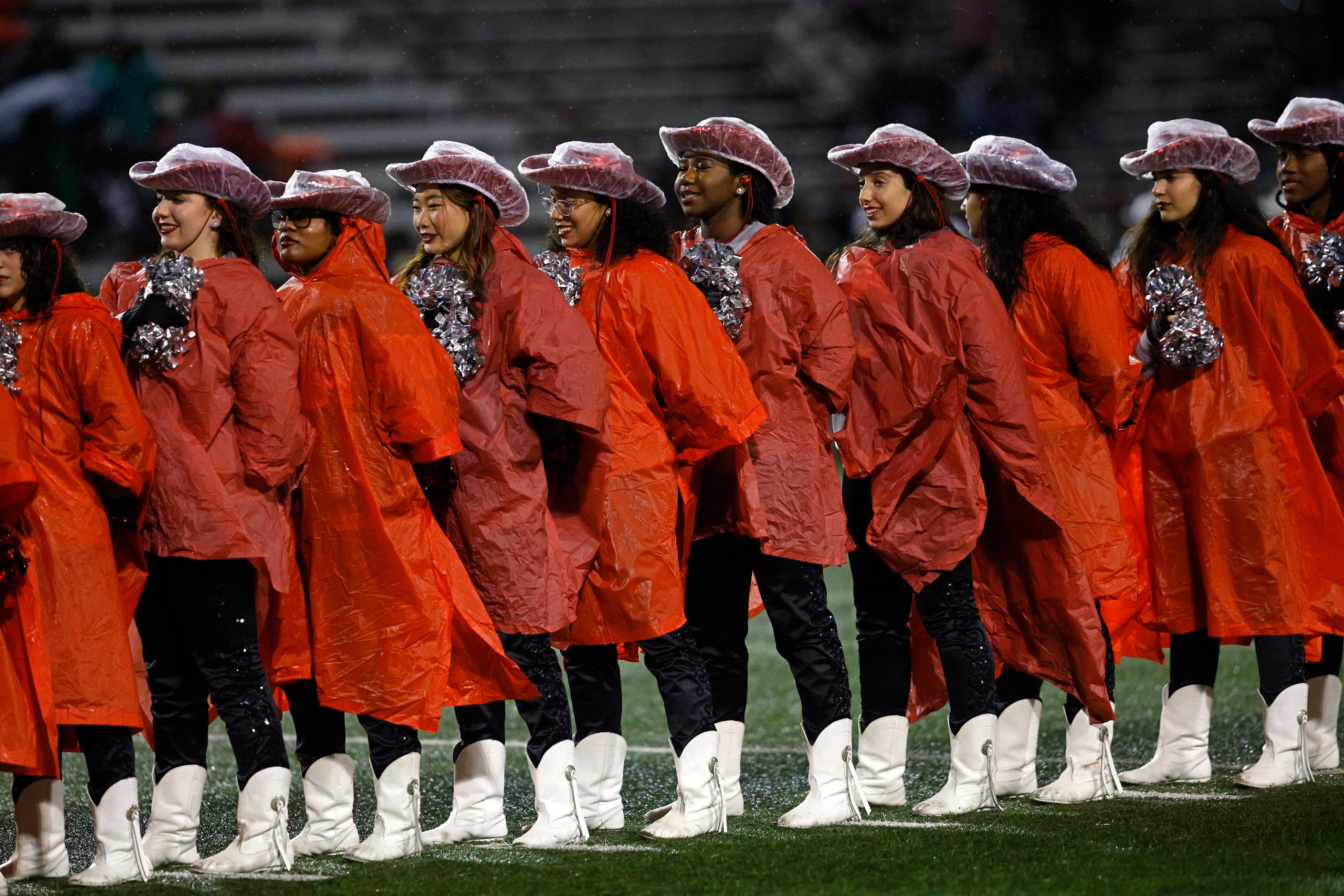  Martin High School Sundancers stand for the national anthem before a high school Class 6A...