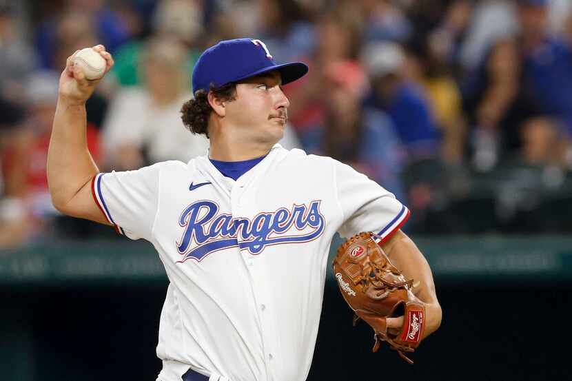 Texas Rangers relief pitcher Owen White (43) delivers a pitch in his major league debut...