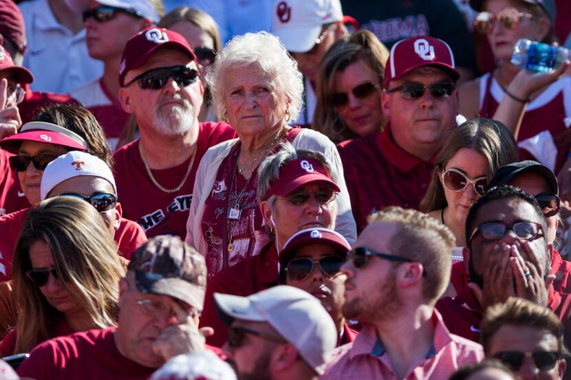 Oklahoma Sooners fan Nancy McCall, 83, watches from the stands during the AT&T Red River...