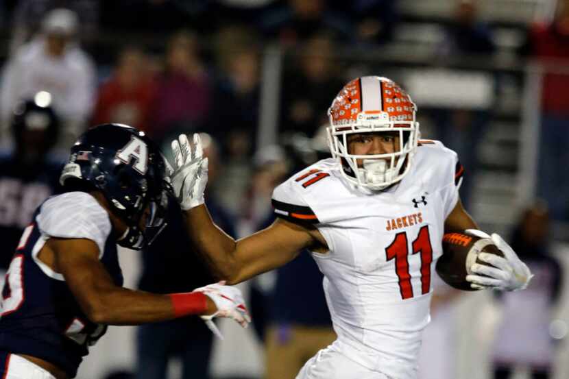 Rockwall's Jaxon Smith-Njigba (11) takes the ball to the end zone for a touchdown, as...