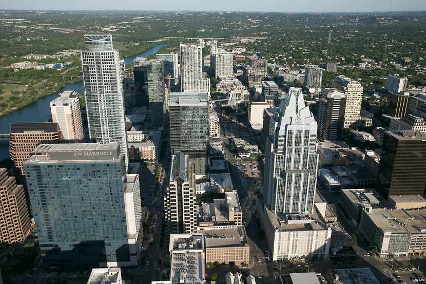 An aerial view of downtown Austin, including the Frost Bank Tower and the J.W. Marriott Hotel.