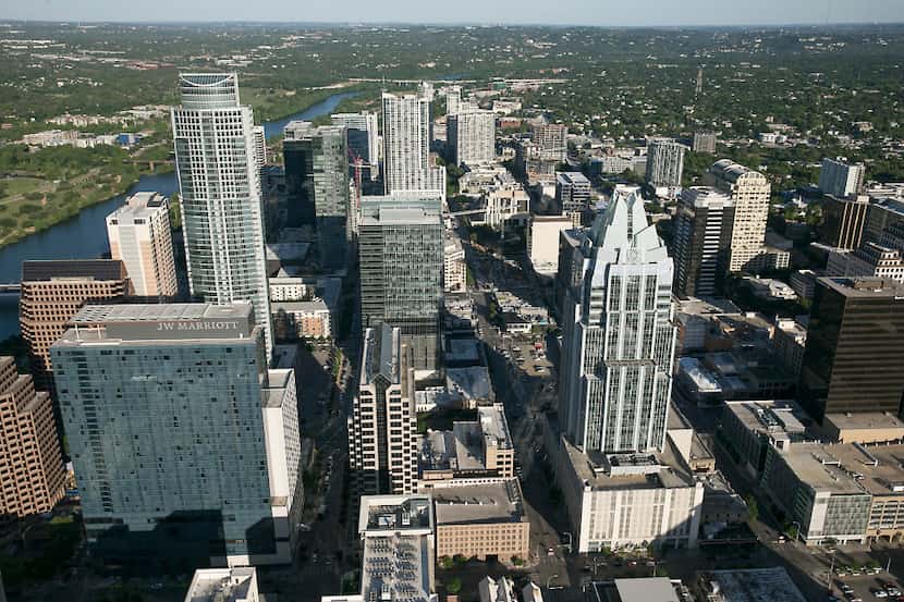 An aerial view of downtown Austin, including the Frost Bank Tower and the J.W. Marriott Hotel.
