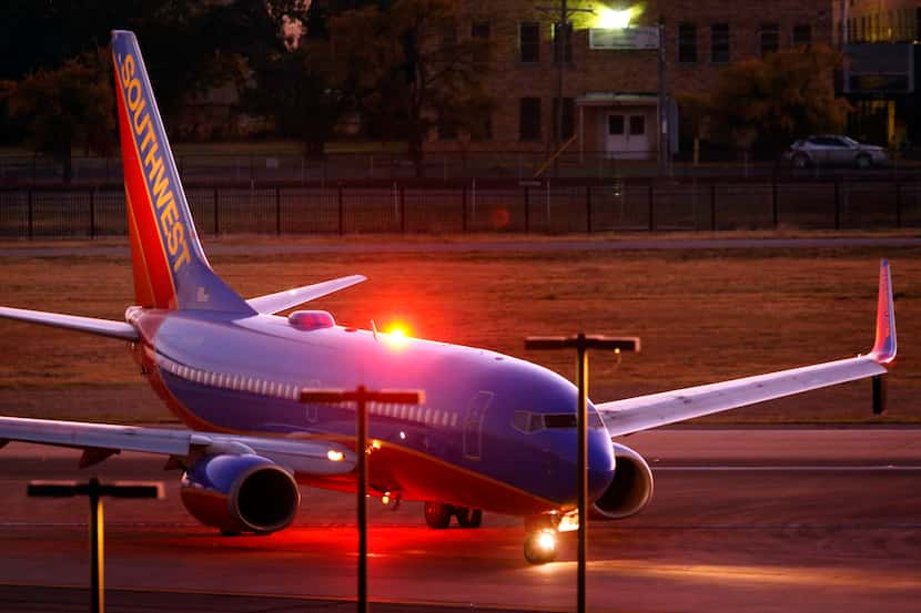 A Southwest Airlines jet taxis to the terminal at Dallas Love Field in October.