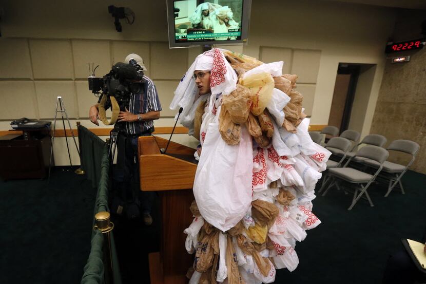 Edward Hartmann of the Texas Campaign for the Environment dresses as a "plastic bag monster"...