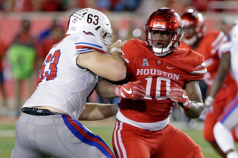 FILE - In this Oct. 7, 2017, file photo, SMU offensive lineman Evan Brown (63) blocks...