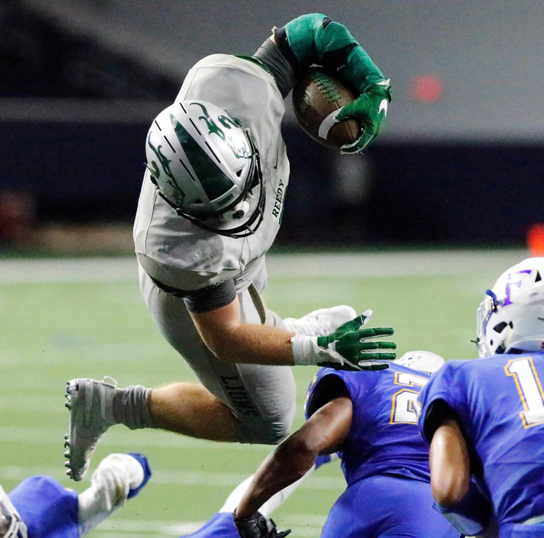 Reedy High School running back Will Harbour (2) fumbled as he was upended by Frisco High...