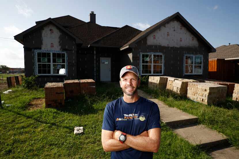 Ryan Martin, a real estate investor, poses for a portrait in front a home he's building at...
