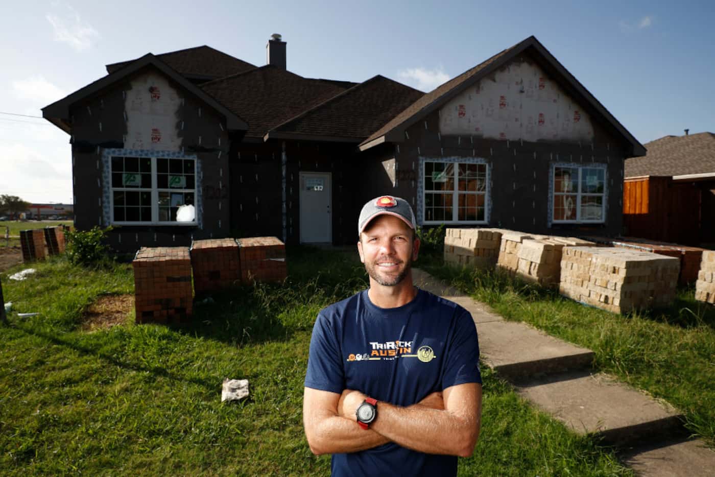 Ryan Martin, a real estate investor, poses for a portrait in front a home he's building at...