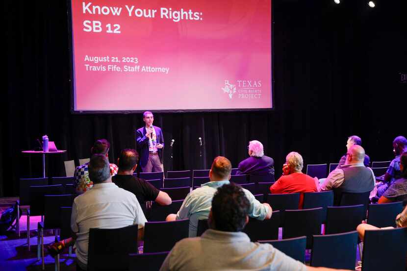 Travis Fife, Texas Civil Rights Project staff attorney, speaks during a presentation and...