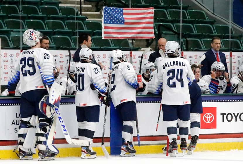 Team USA approached the bench during a break in the action in the first period of the IIHF...