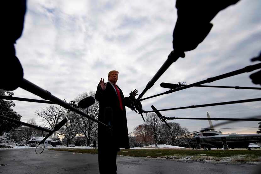 U.S. President Donald Trump speaks to the media as he departs the White House in Washington,...