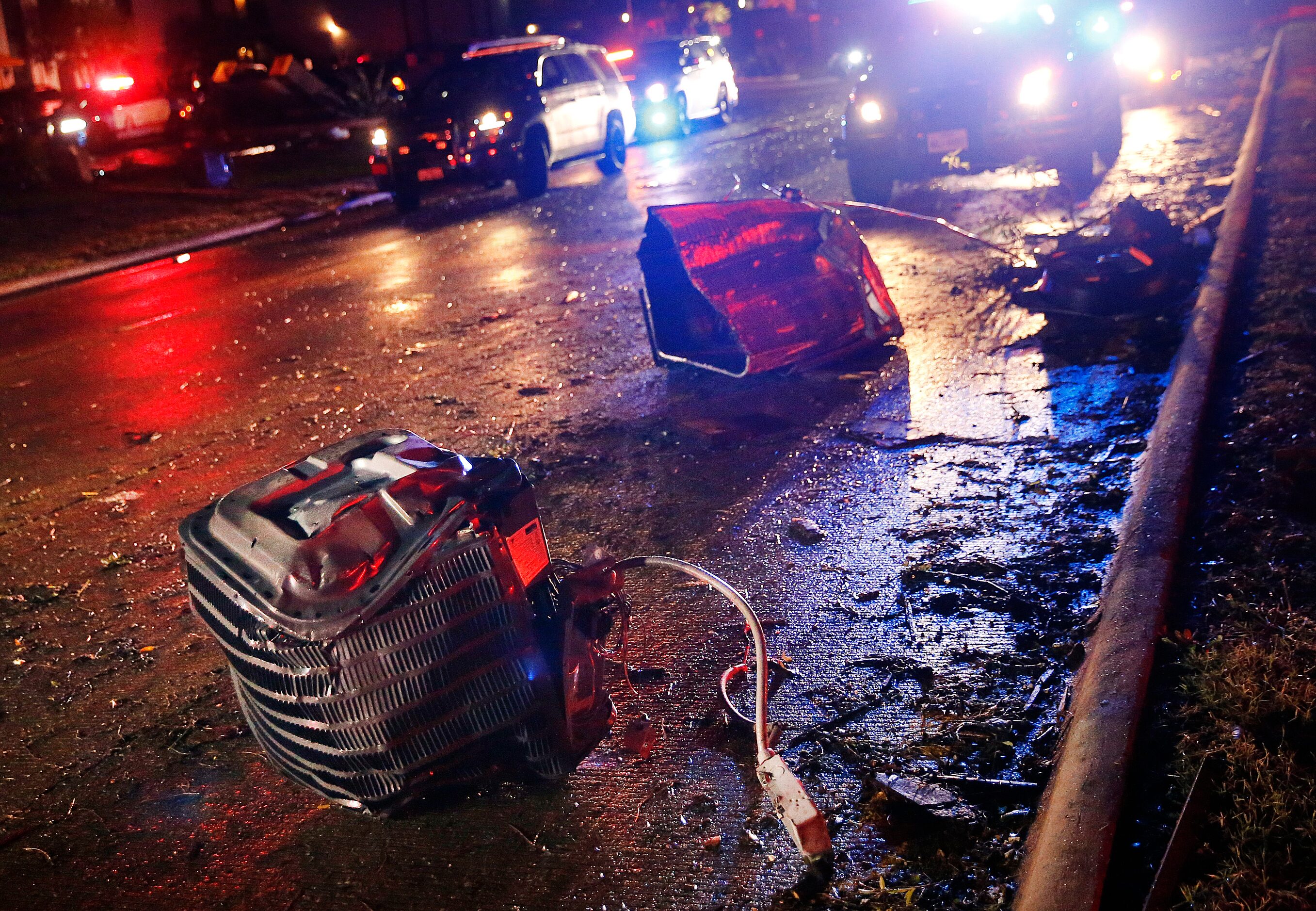 Air conditioner units were scattered across Pioneer Parkway in Arlington after a...