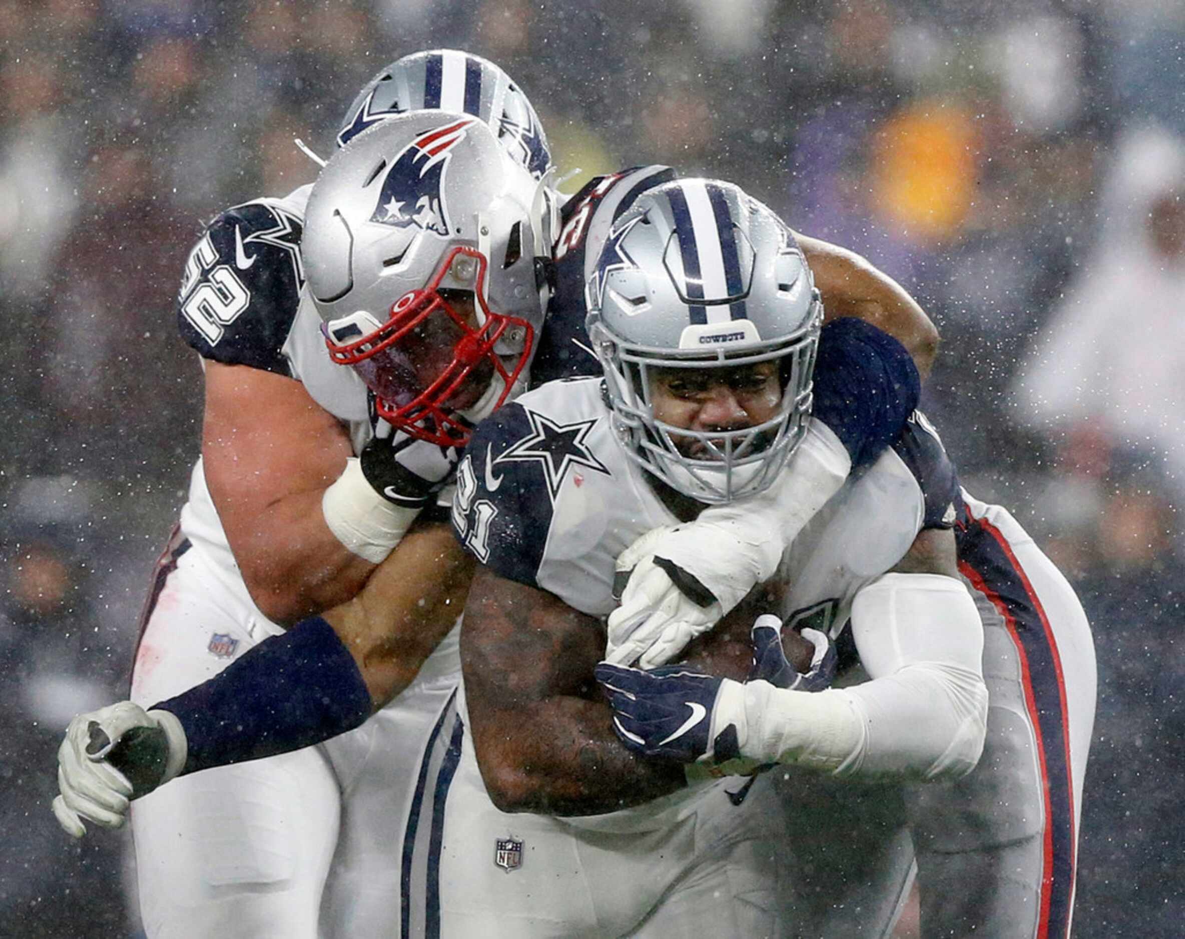 New England Patriots defensive end Deatrich Wise (91) tackles Dallas Cowboys running back...