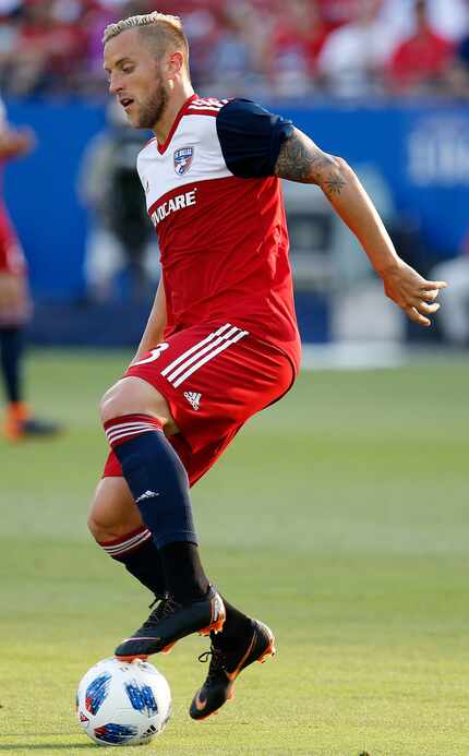 FC Dallas defender Reto Ziegler (3) controls the soccer ball during the first half as FC...