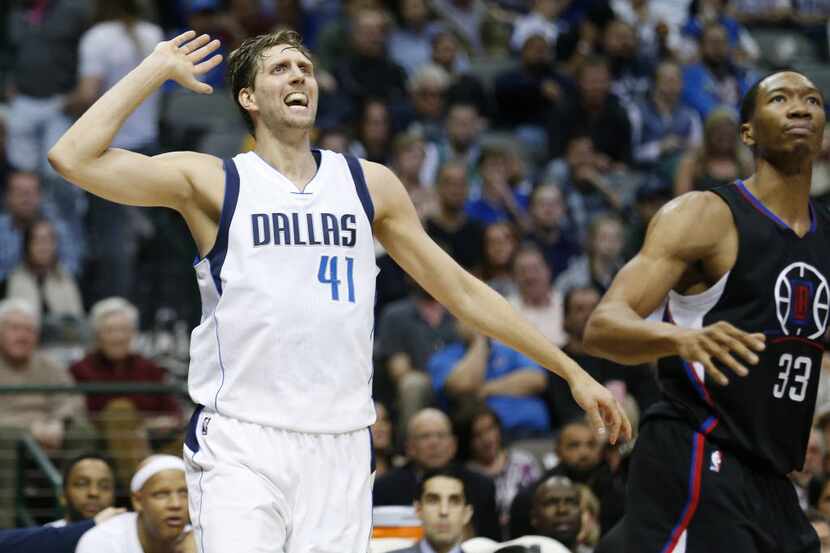 Dallas Mavericks forward Dirk Nowitzki (41) reacts after shooting over Los Angeles Clippers...