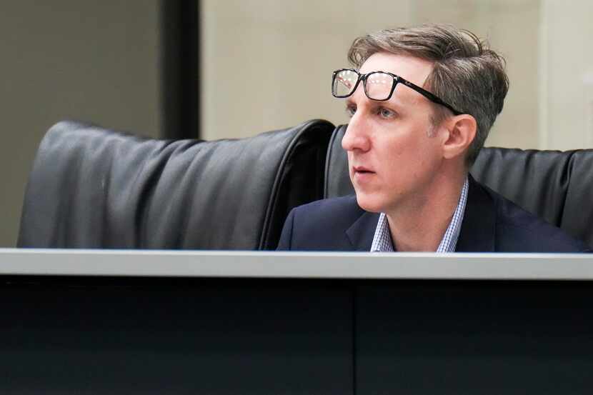 Board member Brandon Friedman listens to a speaker during a meeting of the Dallas Community...