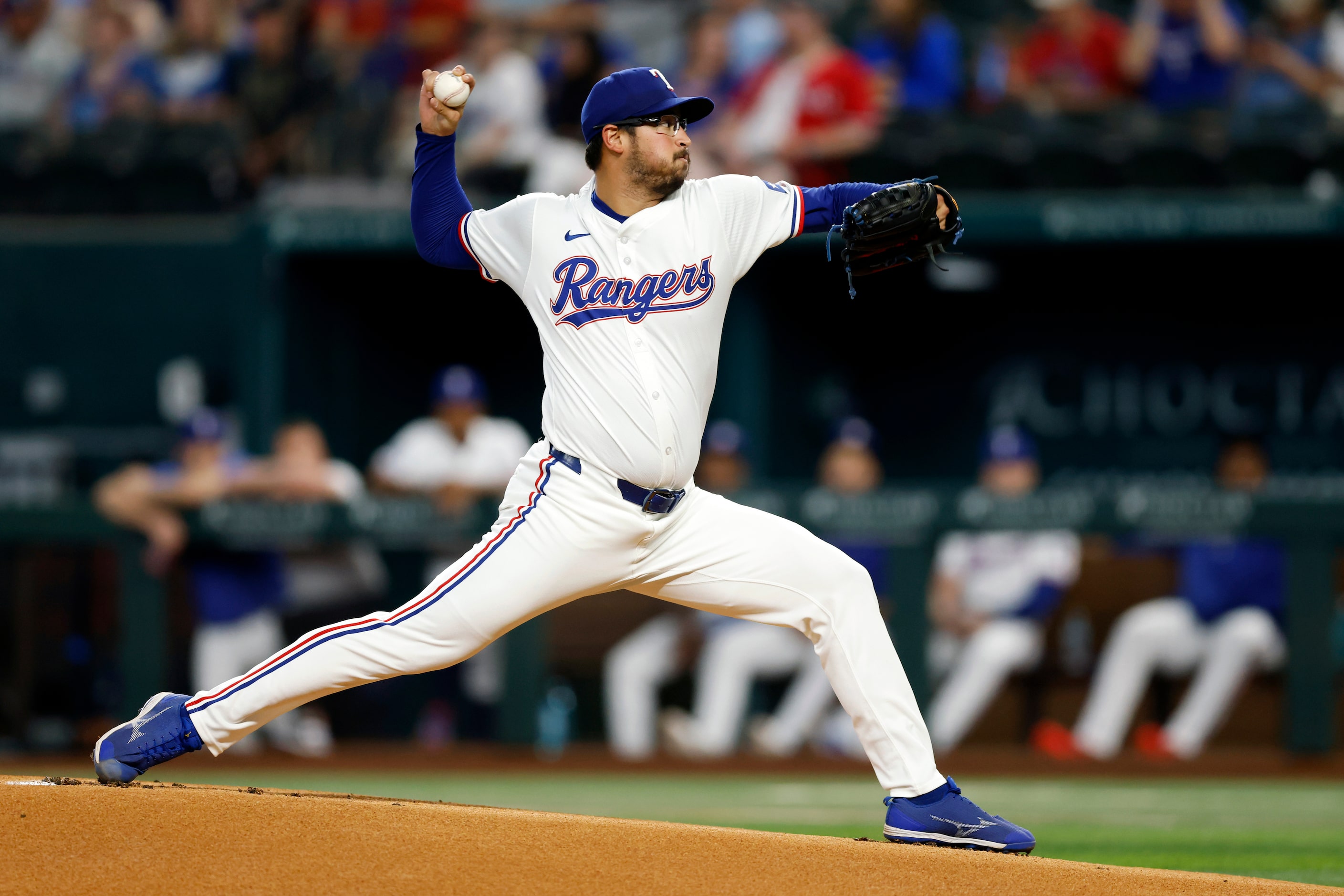 Texas Rangers starting pitcher Dane Dunning (33) delivers a pitch during the first inning...