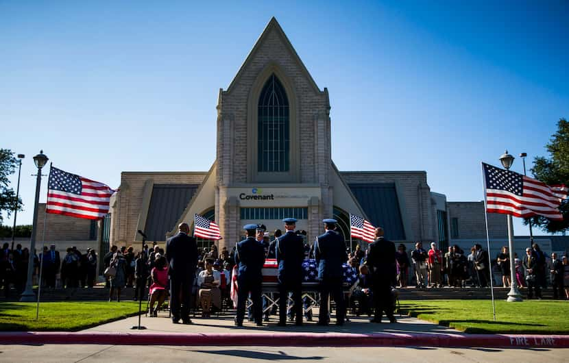 The Spann family and friends gather outside Covenant Church during funeral services for...