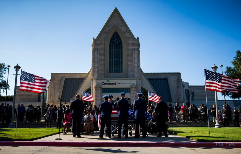 The Spann family and friends gather outside Covenant Church during funeral services for...