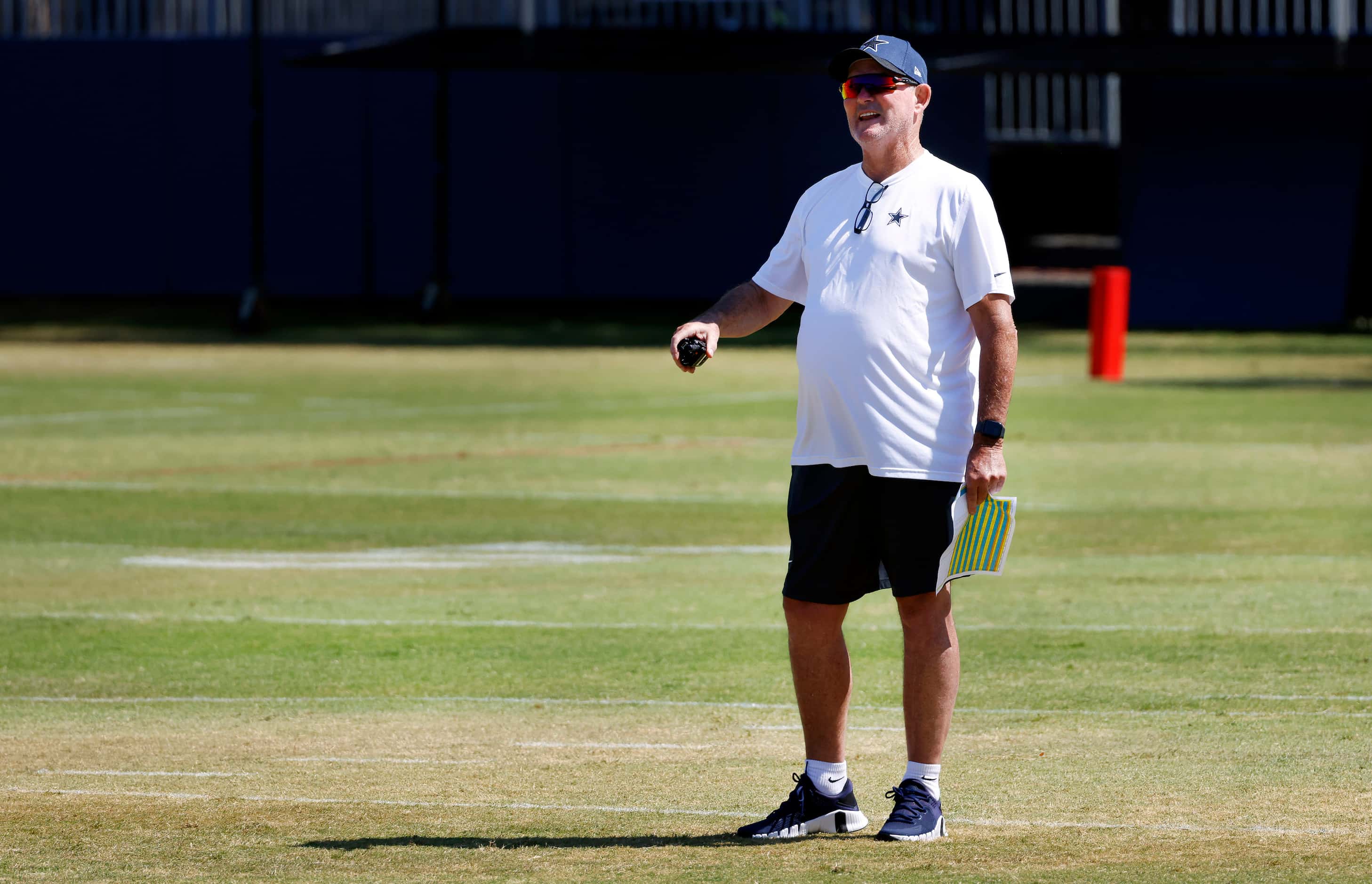 Dallas Cowboys defensive coordinator Mike Zimmer yells to his squad during a mock game in...