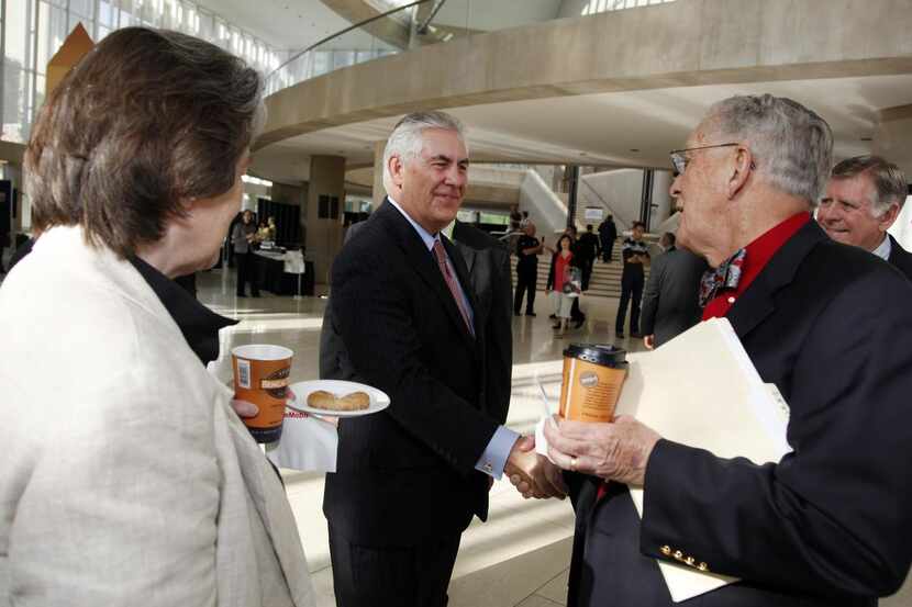 
Exxon Chief Executive Rex Tillerson mingles with shareholders at the annual meeting in...