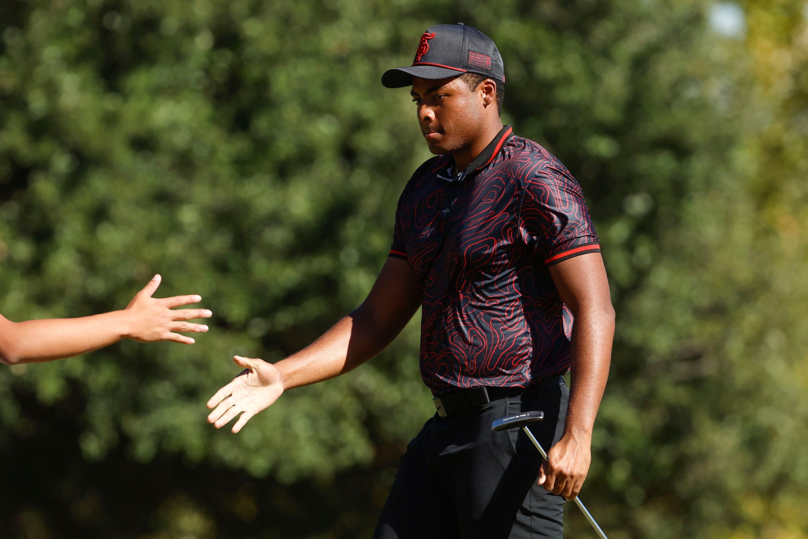 Crowd watch as Kci Lindskog of Texas Southern University  gets congratulated after making a...